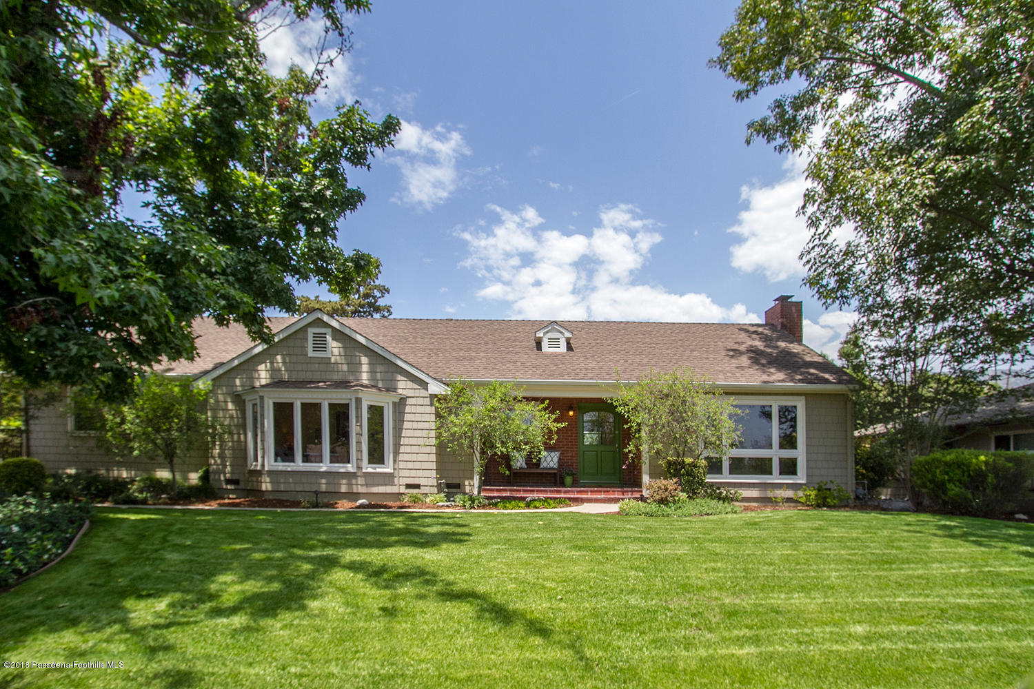 3675 Greenhill Road Pasadena, CA 91107 - Photo 1 of 27 a front view of a house with a garden