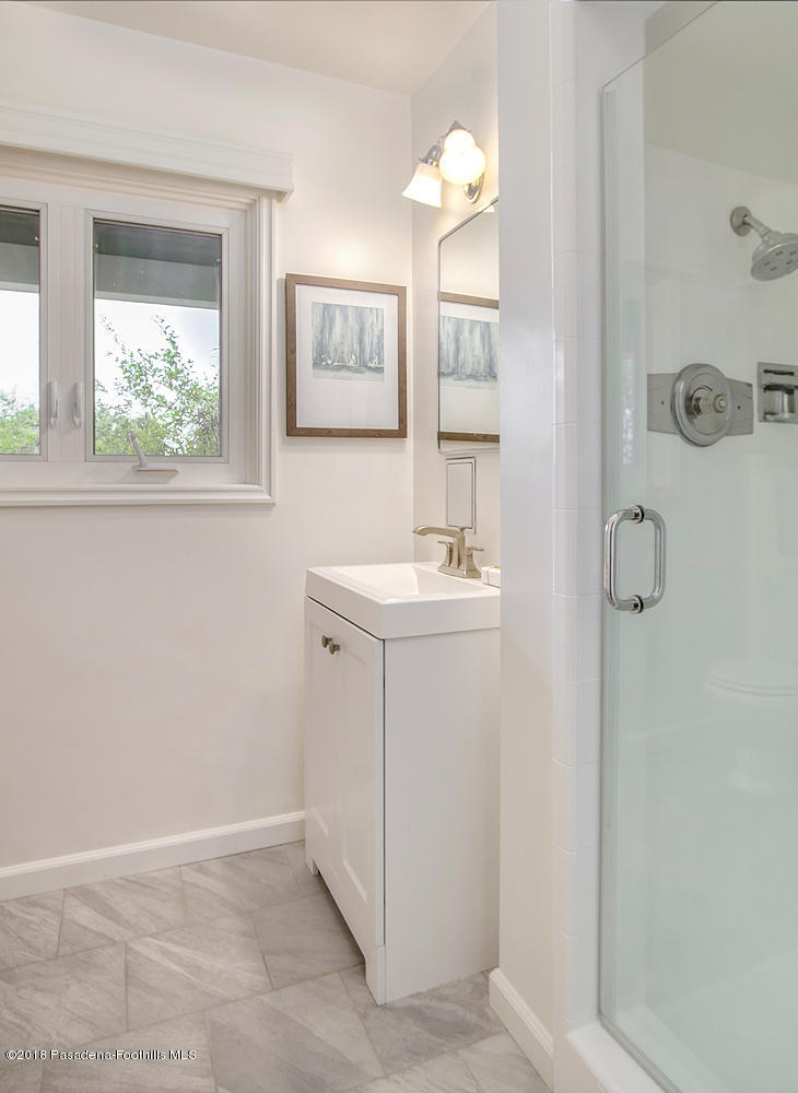 3675 Greenhill Road Pasadena, CA 91107 - Photo 13 of 27 a bathroom with a sink mirror and vanity