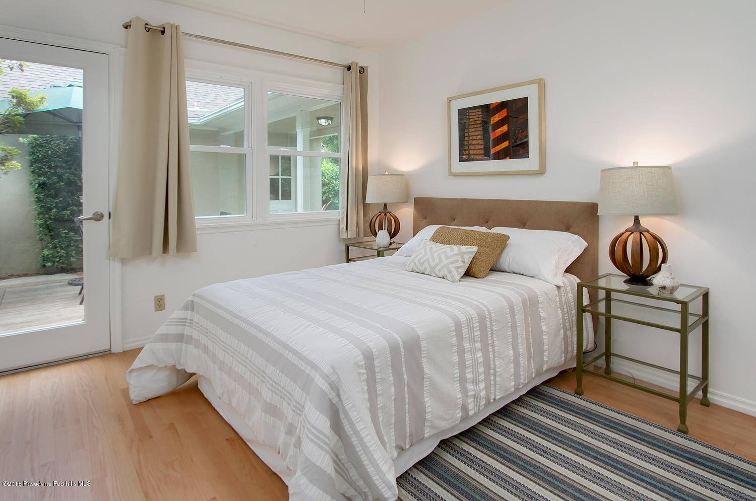 3675 Greenhill Road Pasadena, CA 91107 - Photo 18 of 27 a bedroom with a bed and a window