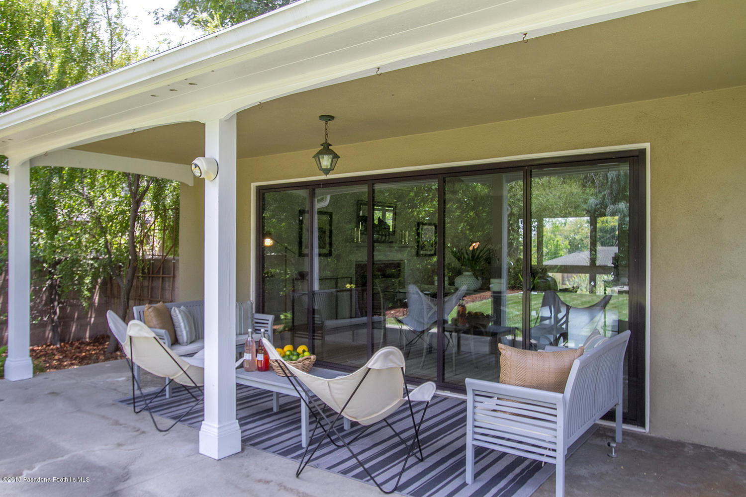 3675 Greenhill Road Pasadena, CA 91107 - Photo 20 of 27 a view of a patio with a dining table and chairs