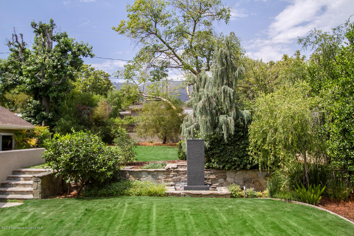 3675 Greenhill Road Pasadena, CA 91107 - Photo 24 of 27 a view of a garden with a tree