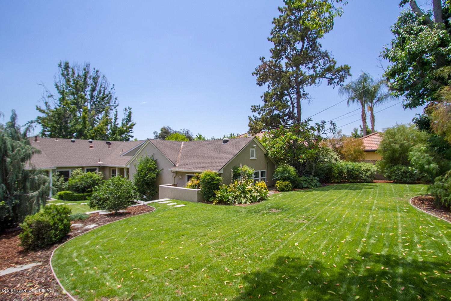 3675 Greenhill Road Pasadena, CA 91107 - Photo 25 of 27 a view of a house with a garden