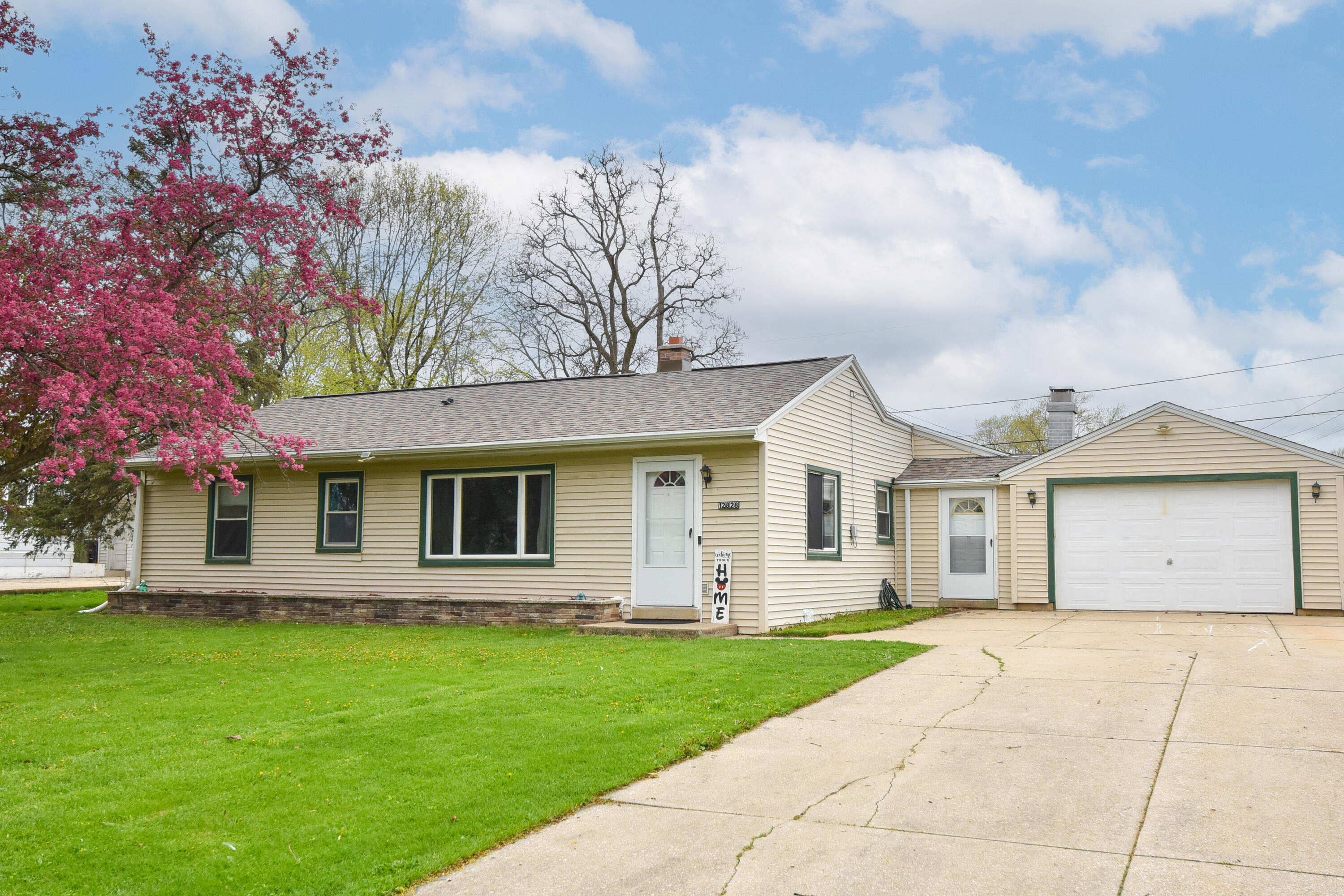 12828 West Stark Street Butler, WI 53007 - Photo 1 of 1 Long concrete drive for ease in maintenance and plenty of parking space! Good sized front yard to throw the ball around.