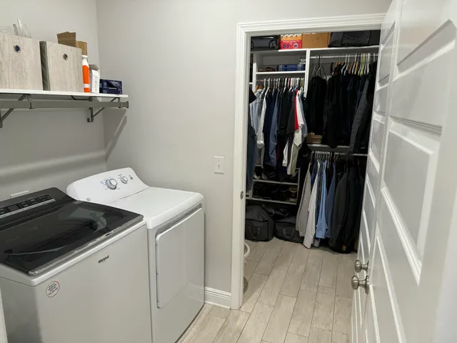 a view of patio with table and chairs and potted plants