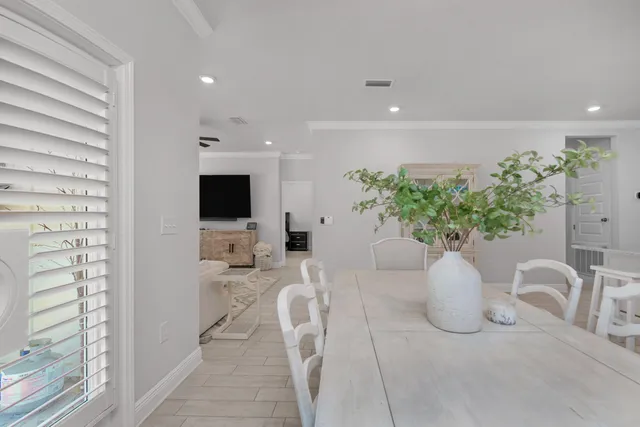 a bedroom with a bed and a ceiling fan