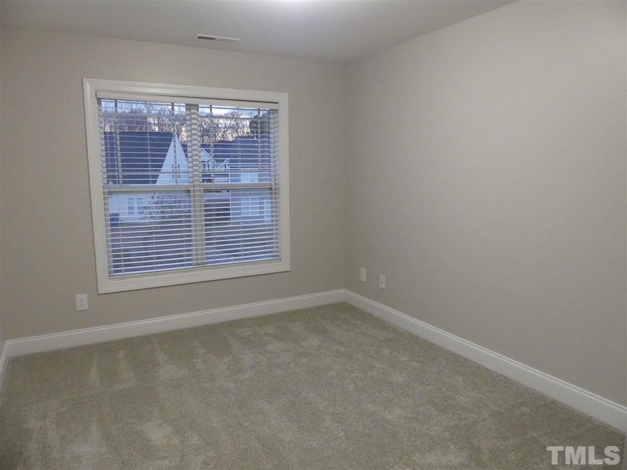 3938 Patriot Ridge Court Raleigh, NC 27610 - Photo 22 of 28 an empty room with a window