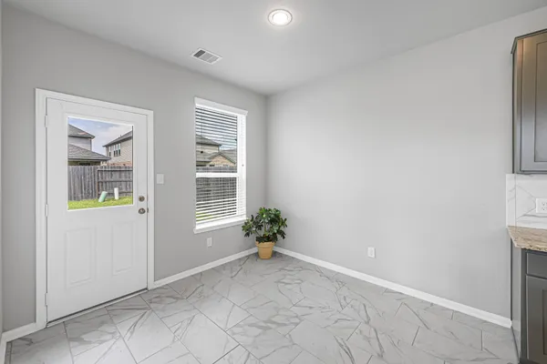 a view of an empty room with a window