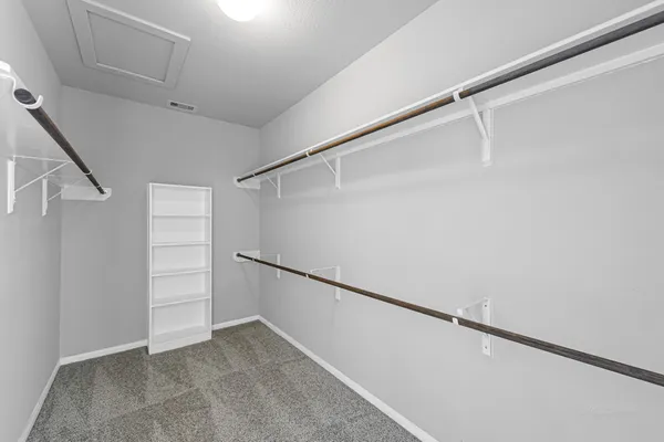a view of an empty walk in closet