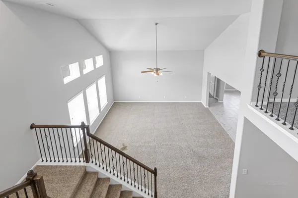 a view of a hallway with windows