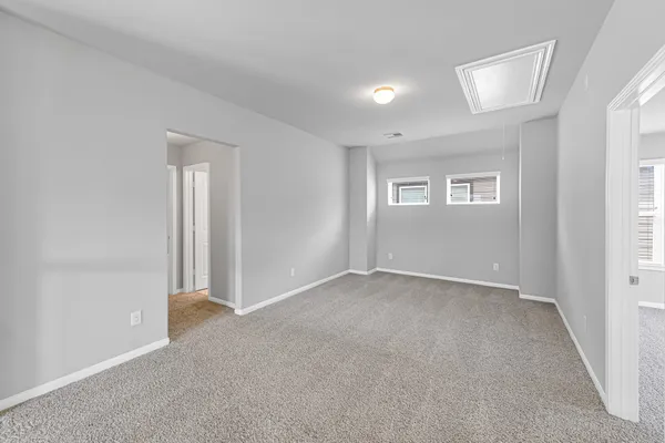 a view of an empty room with a window