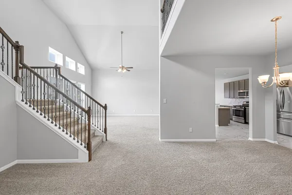 a view interior of a house with an entryway and stairs