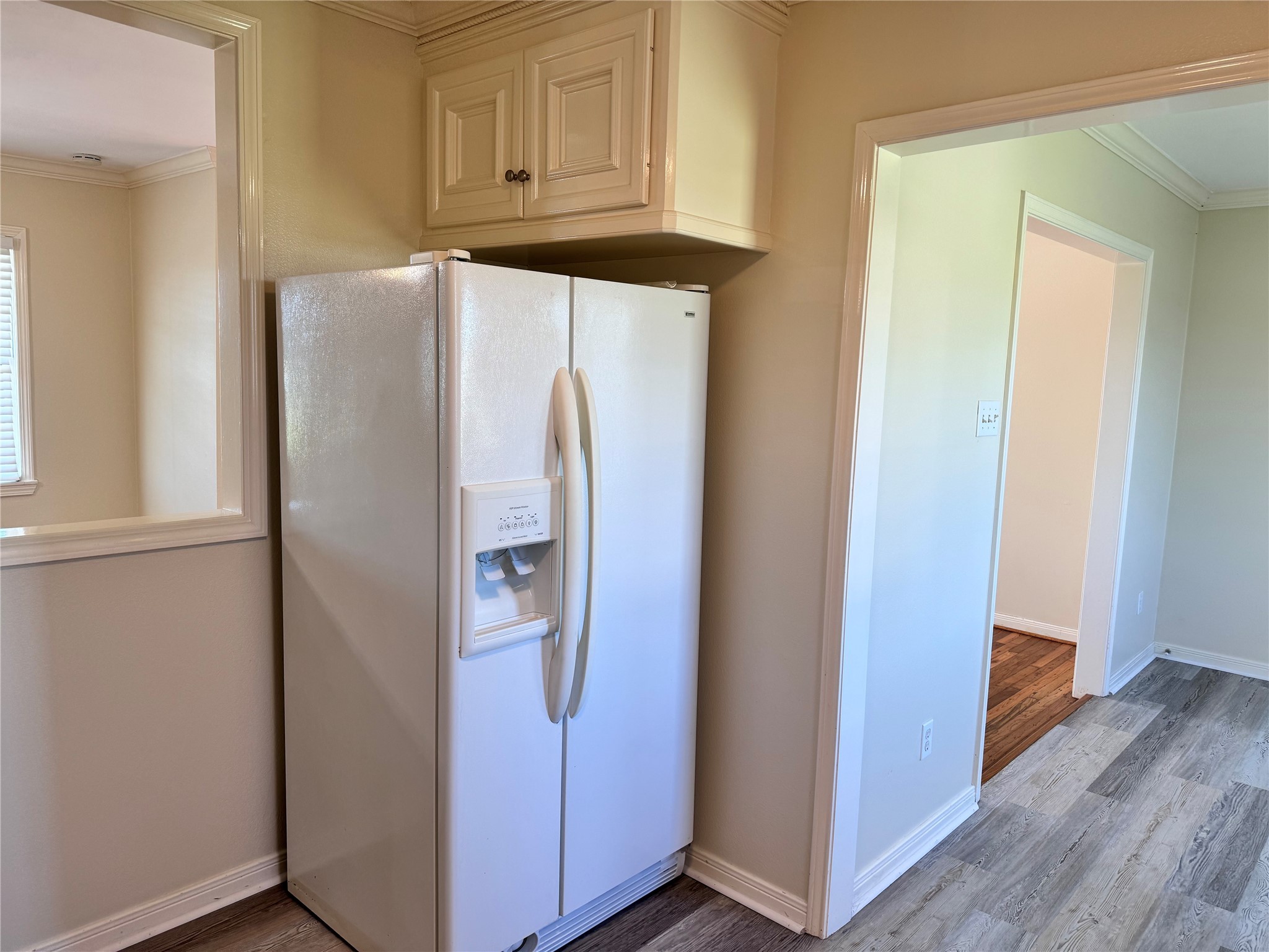 2515 Broome Road Galveston, TX 77554 - Photo 4 of 13 a white refrigerator freezer sitting inside of a kitchen