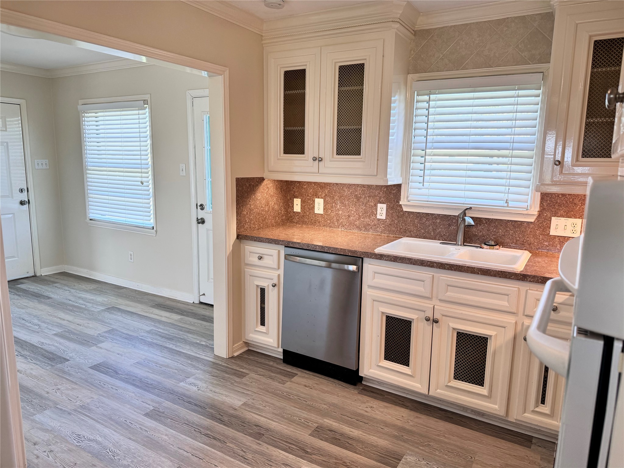 2515 Broome Road Galveston, TX 77554 - Photo 5 of 13 a kitchen with stainless steel appliances granite countertop a stove and a sink