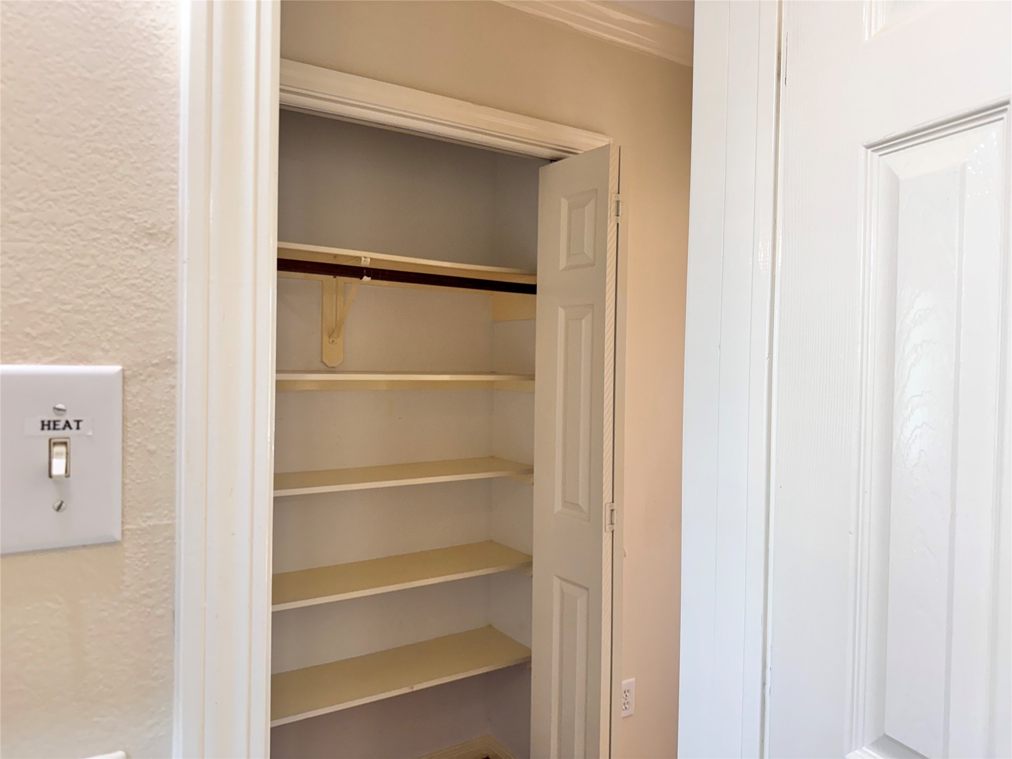 2515 Broome Road Galveston, TX 77554 - Photo 10 of 13 a view of walk in closet with empty racks