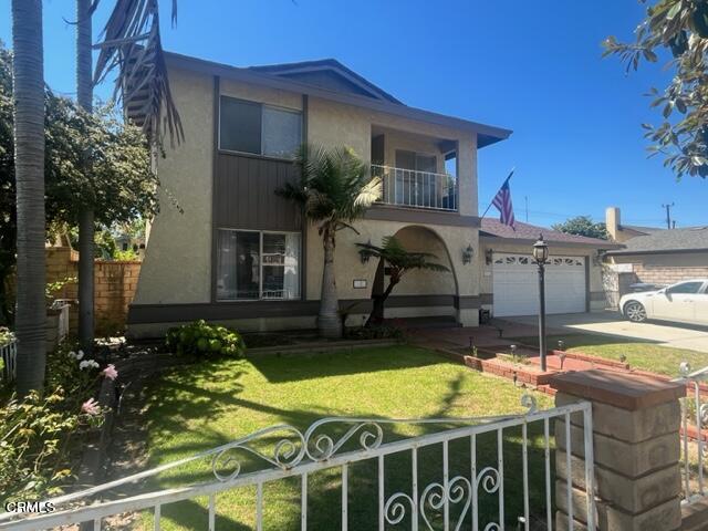 a view of a house with swimming pool and sitting area