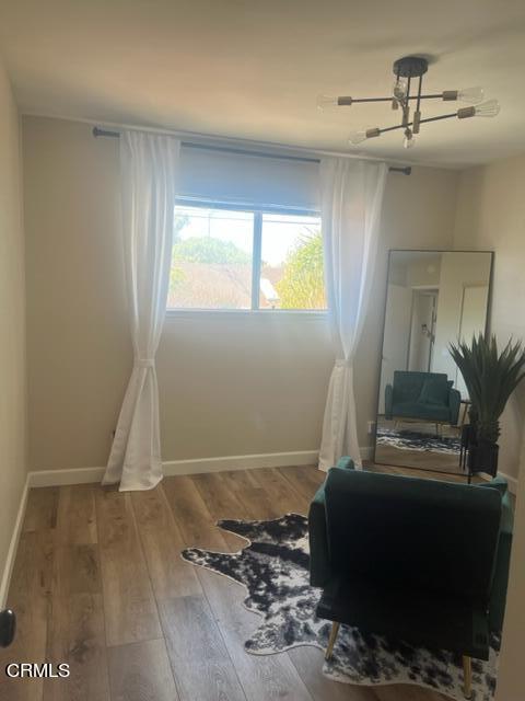 2065 Ironbark Drive Oxnard, CA 93036 - Photo 12 of 17 a living room with a couch and a potted plant