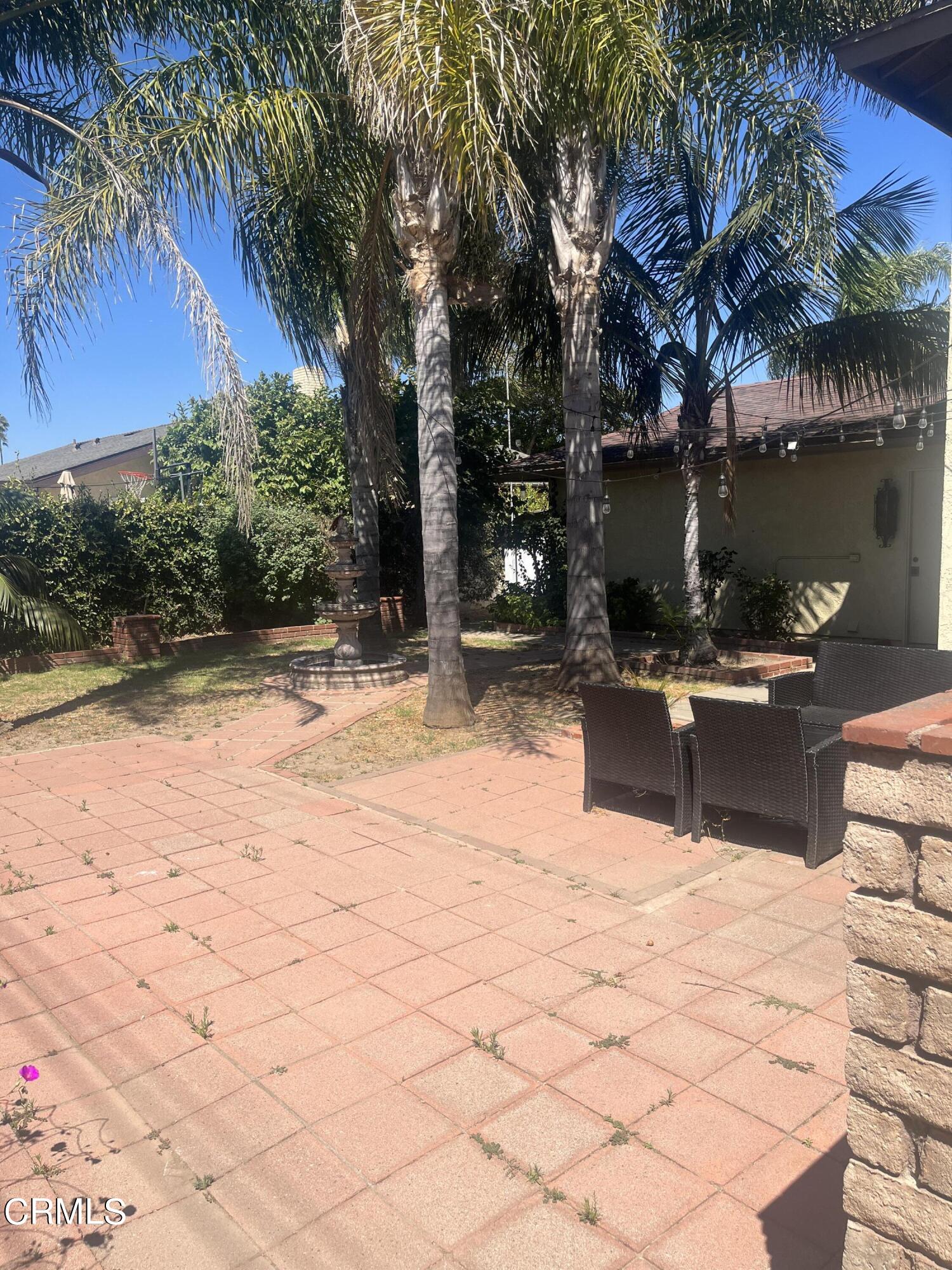 2065 Ironbark Drive Oxnard, CA 93036 - Photo 16 of 17 a swimming pool with outdoor seating and yard