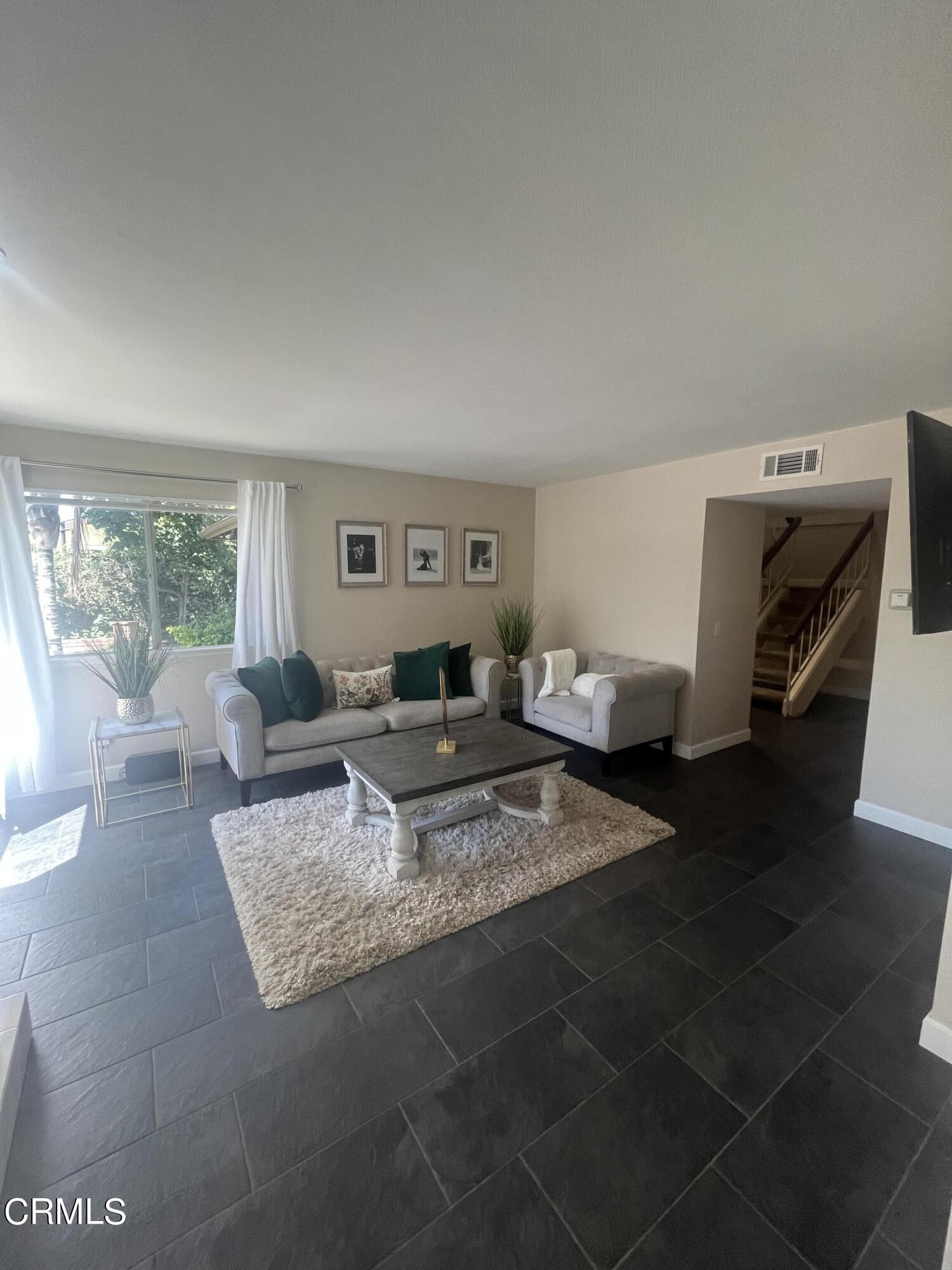 2065 Ironbark Drive Oxnard, CA 93036 - Photo 2 of 17 a living room with furniture and a window