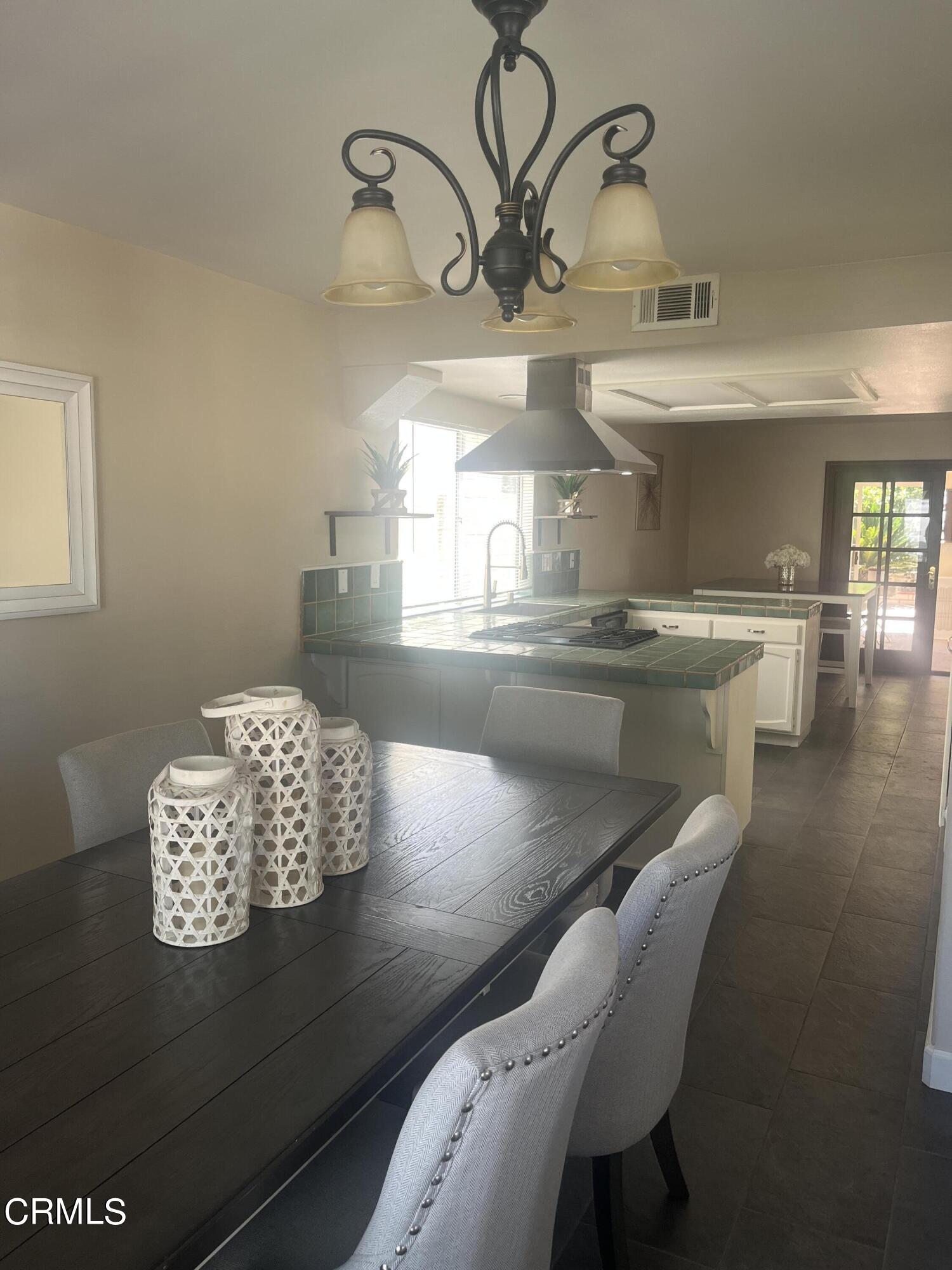 2065 Ironbark Drive Oxnard, CA 93036 - Photo 5 of 17 a view of a dining room with furniture