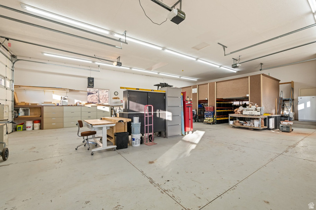 779 South Silver Road Leeds, UT 84746 - Photo 64 of 80 Garage featuring white fridge and a garage door opener