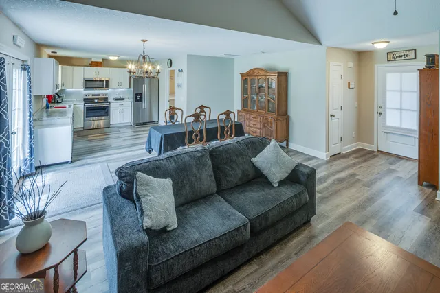 a bedroom with a bed and a table in it