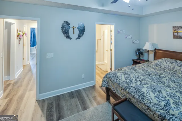 a bathroom with double vanity sinks and a mirror
