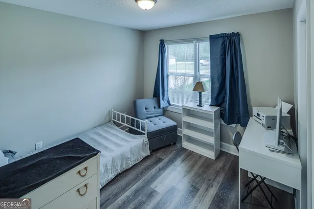 wooden floor in an empty room and a window