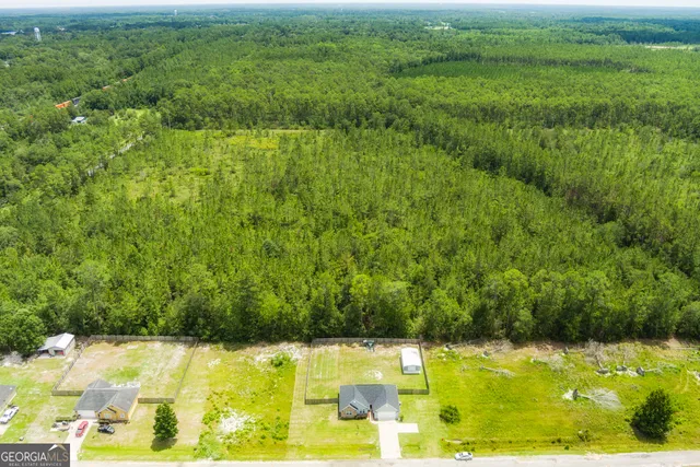 a house view with swimming pool in front of it