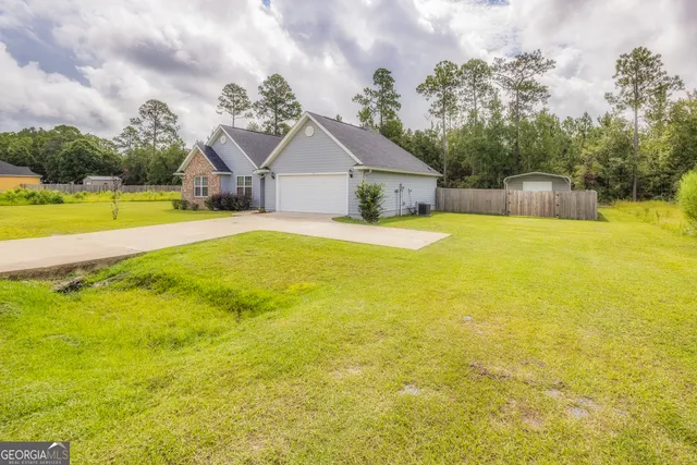 a kitchen with stainless steel appliances granite countertop a refrigerator and a stove