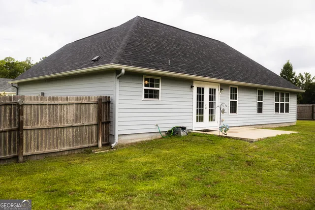 a kitchen with stainless steel appliances granite countertop a stove and a microwave