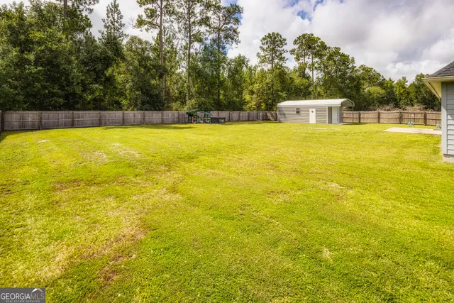 a kitchen with granite countertop cabinets sink and window