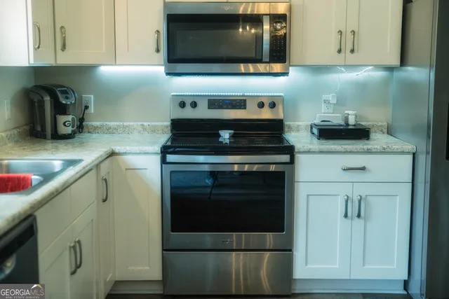 a view of front door of house with a yard