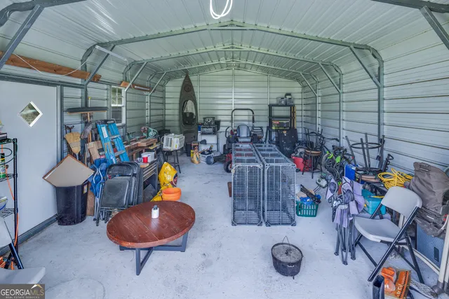 a view of a house with a big yard and a large tree