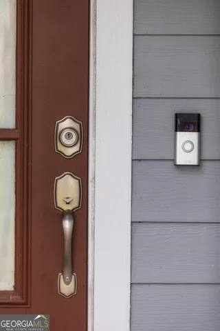 a aerial view of a house next to a yard