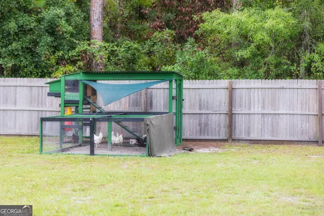 a front view of house with yard and garage