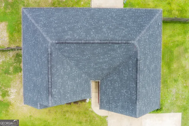 a view of a backyard of the house