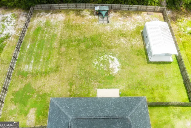 a view of a swimming pool with an outdoor space and seating area