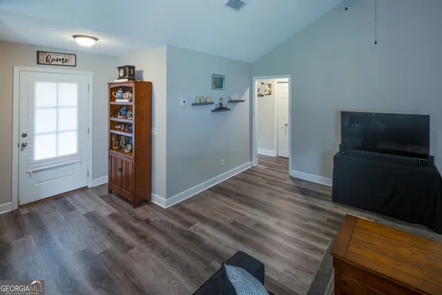 a kitchen with stainless steel appliances granite countertop a refrigerator sink and cabinets