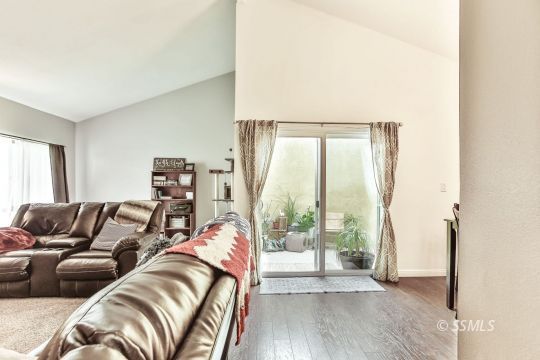 1023 North Norma Street Ridgecrest, CA 93555 - Photo 4 of 32 a living room with a couch and a large window