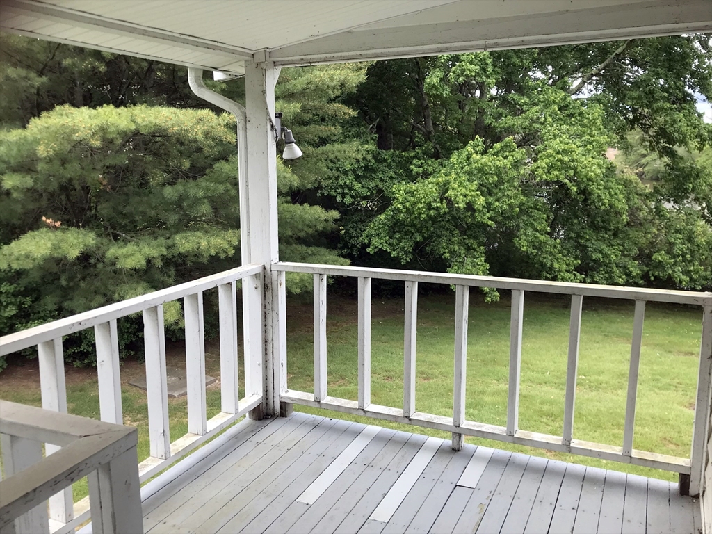 393 West Street, Unit 2 Walpole, MA 02081 - Photo 18 of 21 a view of a wooden deck