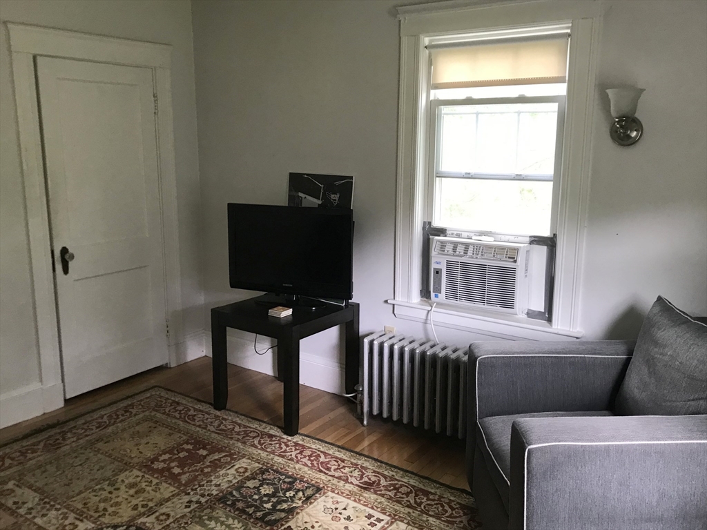 393 West Street, Unit 2 Walpole, MA 02081 - Photo 7 of 21 a living room with furniture and a window