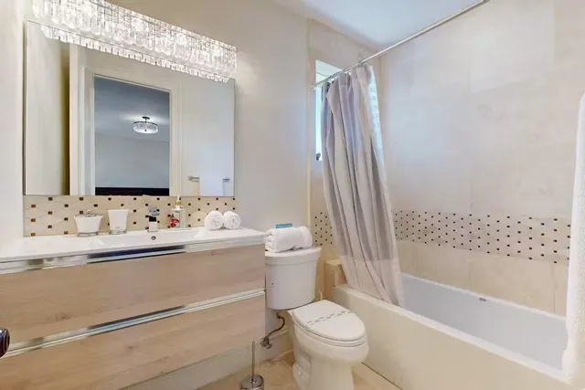 a bathroom with a sink a toilet and a bathtub