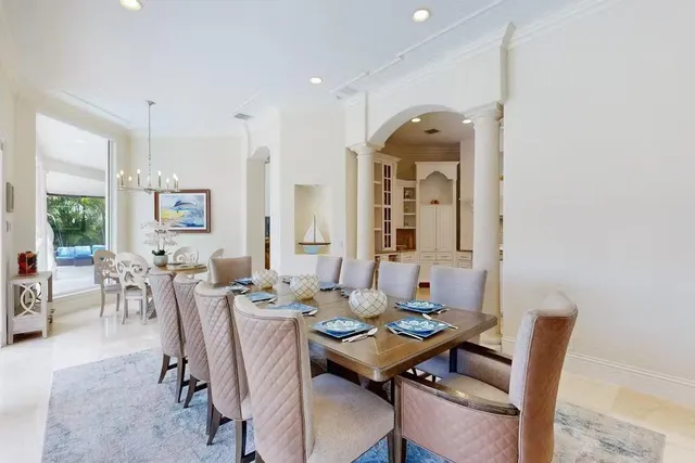 a view of a dining room with furniture window and outside view
