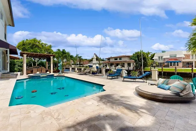 a view of swimming pool with outdoor seating