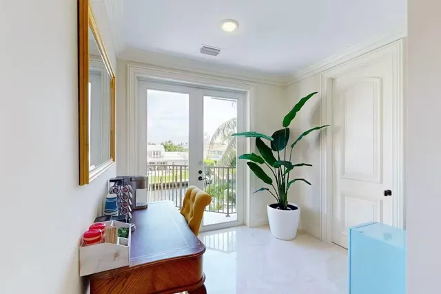 a view of living room with furniture and potted plant