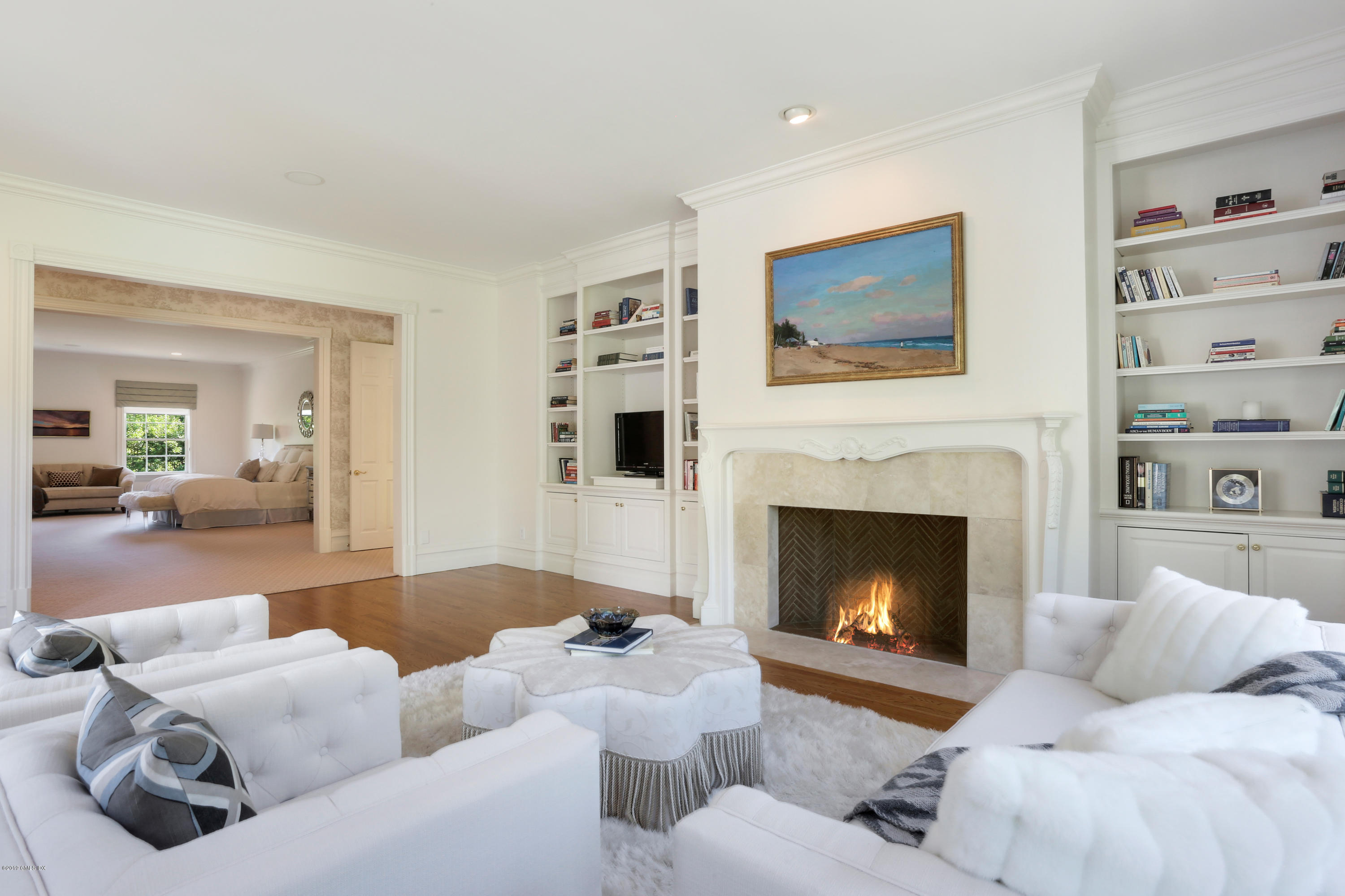 15 Knollwood Drive Greenwich, CT 06830 - Photo 14 of 30 a living room with furniture fireplace and a flat screen tv