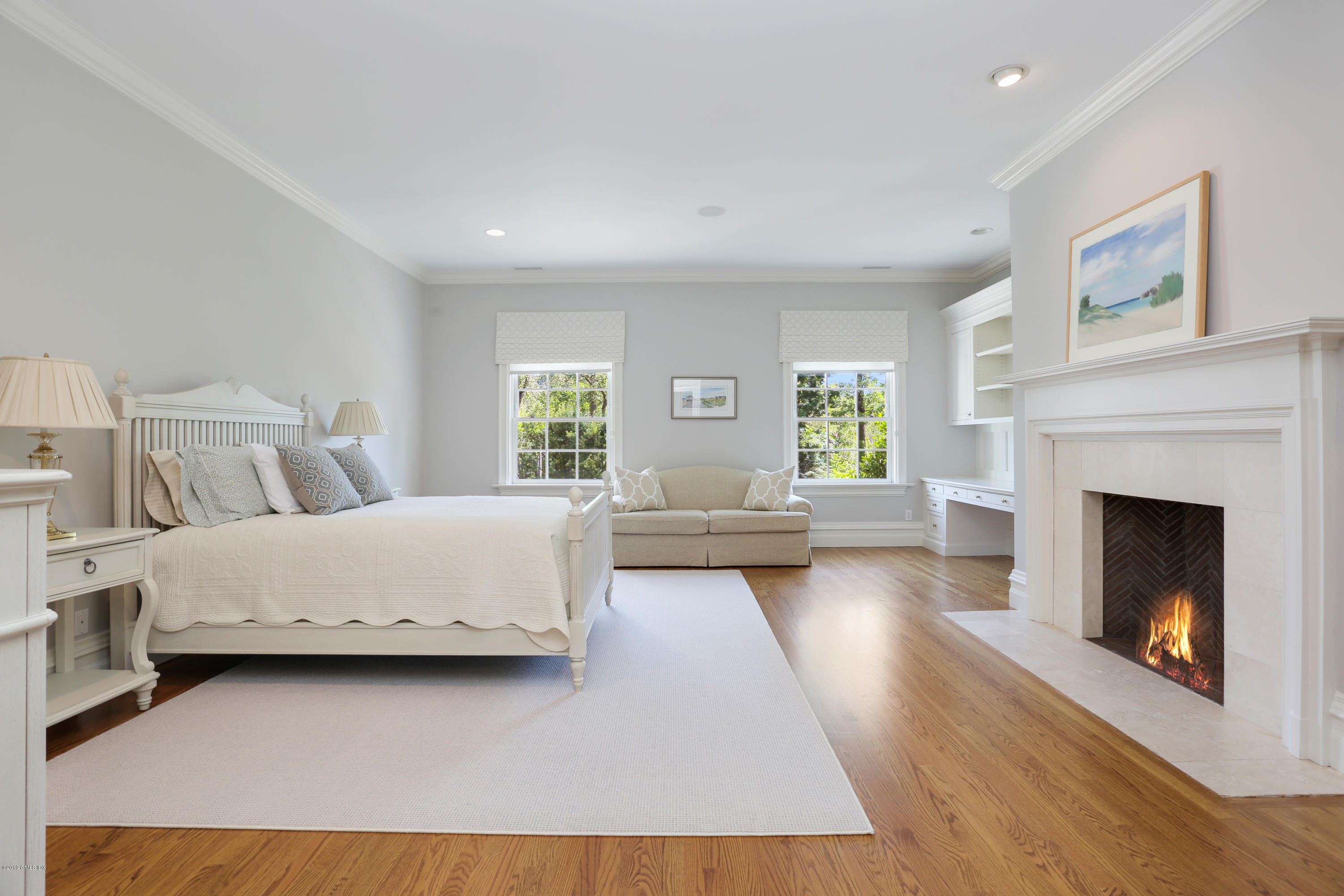 15 Knollwood Drive Greenwich, CT 06830 - Photo 17 of 30 a bedroom with a large bed and a fireplace