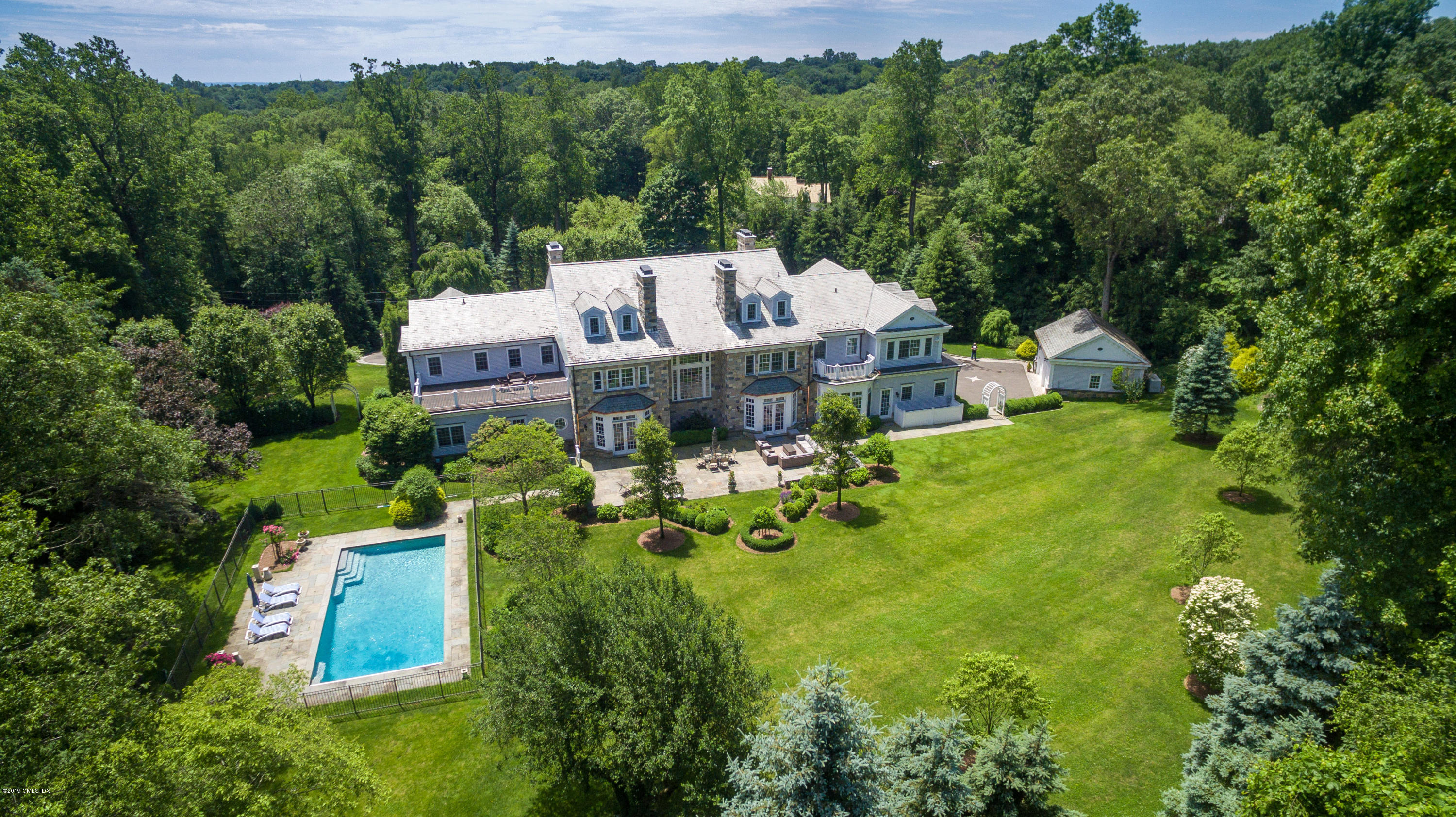 15 Knollwood Drive Greenwich, CT 06830 - Photo 2 of 30 an aerial view of a house with yard swimming pool and outdoor seating