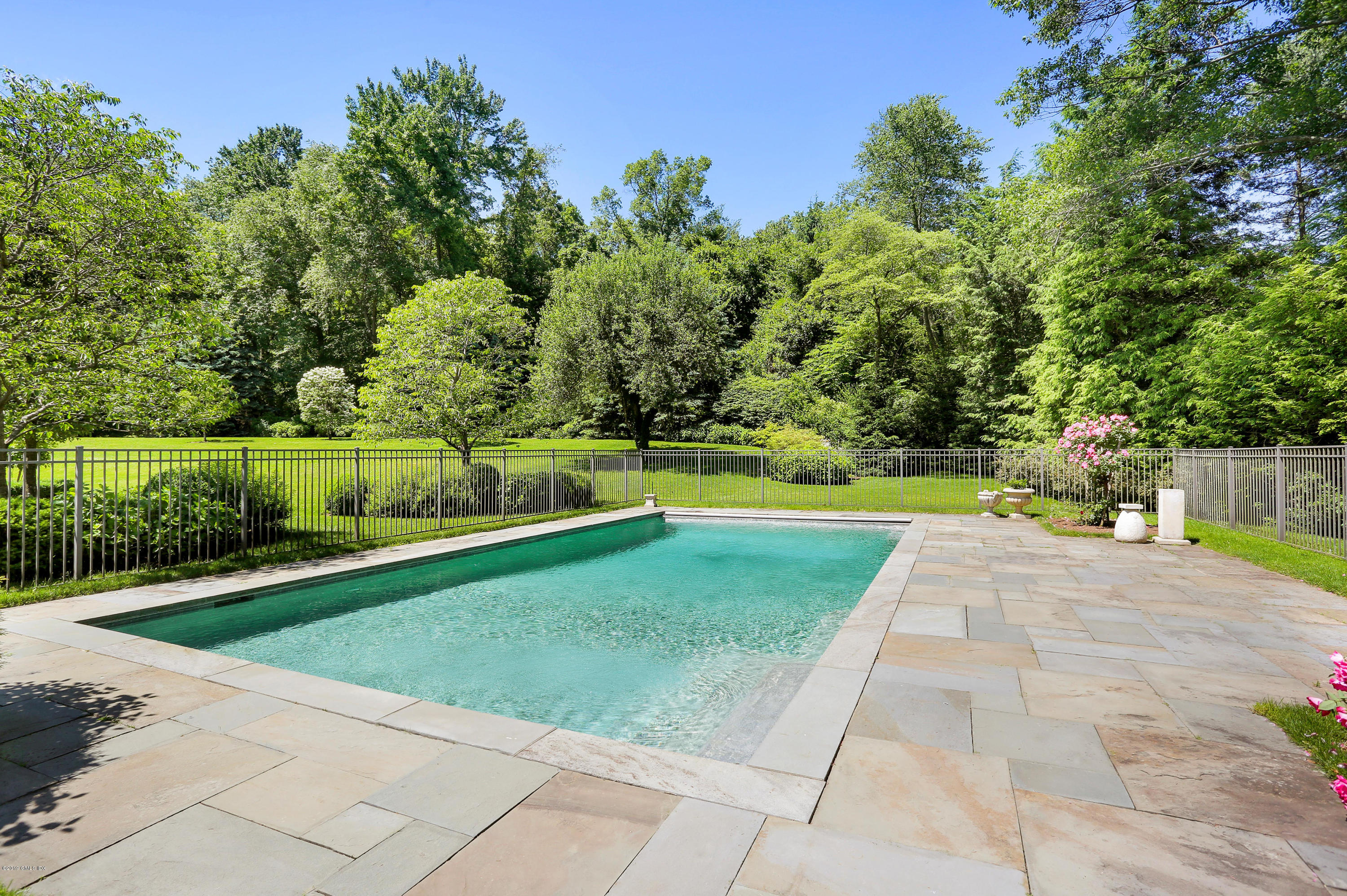 15 Knollwood Drive Greenwich, CT 06830 - Photo 25 of 30 a view of backyard with swimming pool and green space