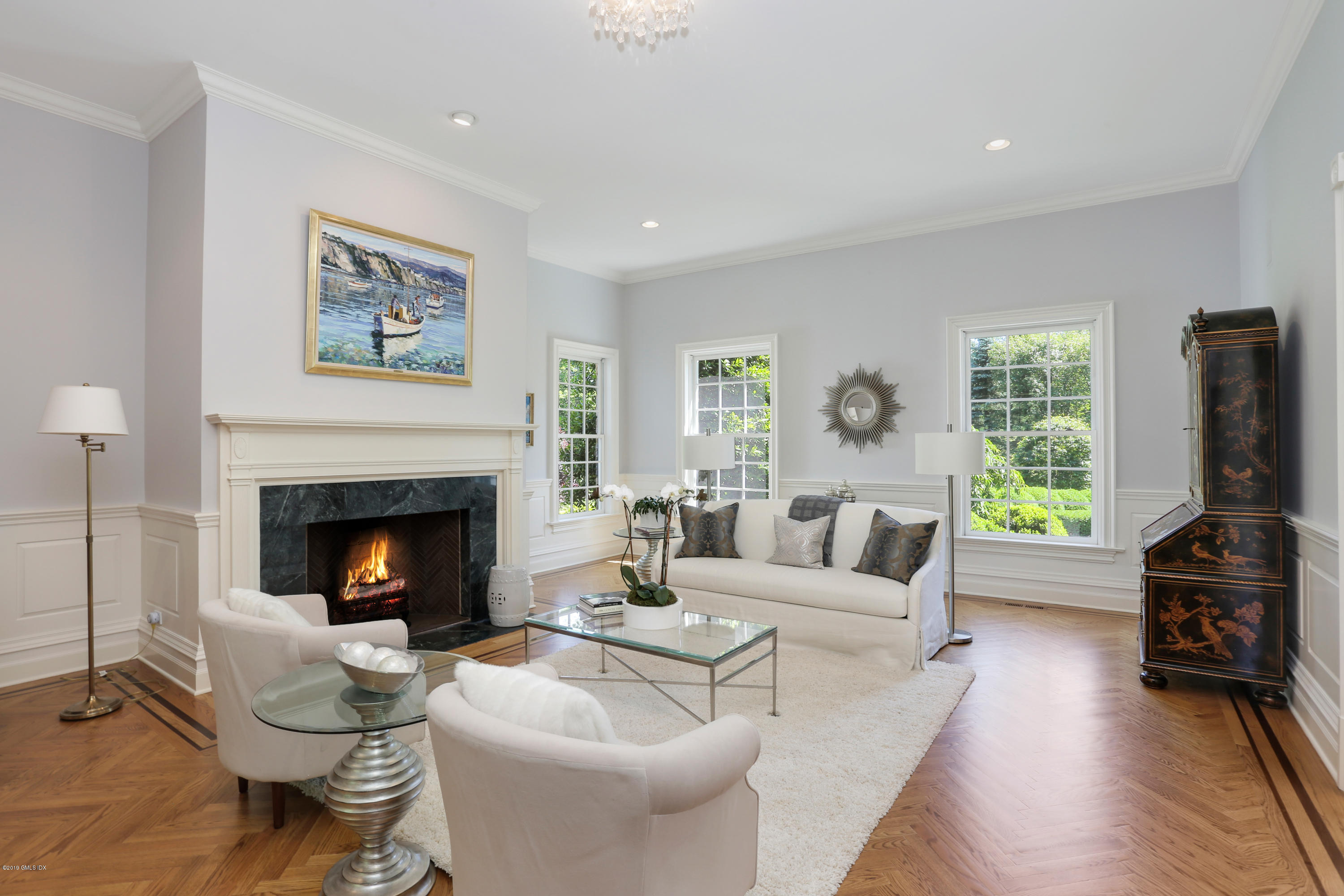 15 Knollwood Drive Greenwich, CT 06830 - Photo 4 of 30 a living room with furniture a fireplace and a flat screen tv